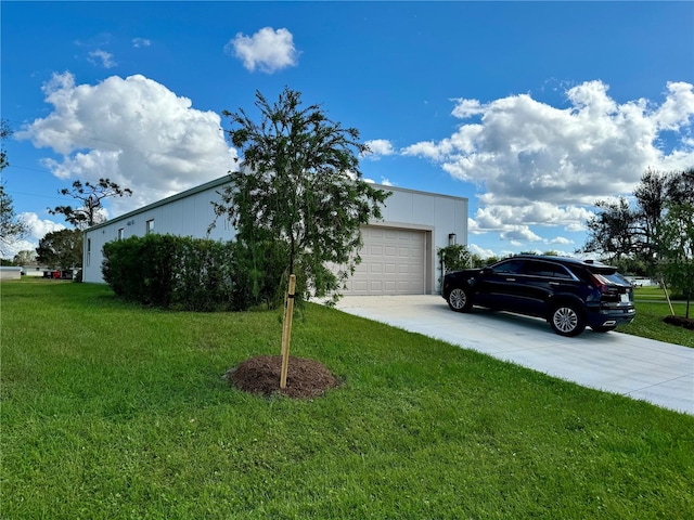 view of front of property with a front lawn and a garage