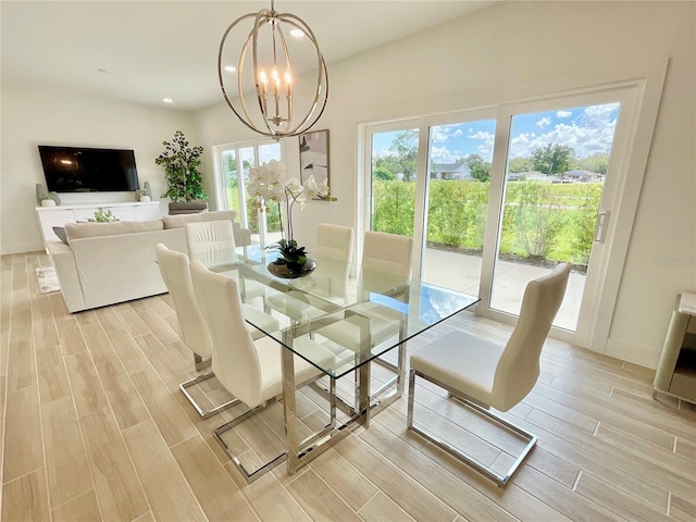 dining room featuring light hardwood / wood-style floors and an inviting chandelier