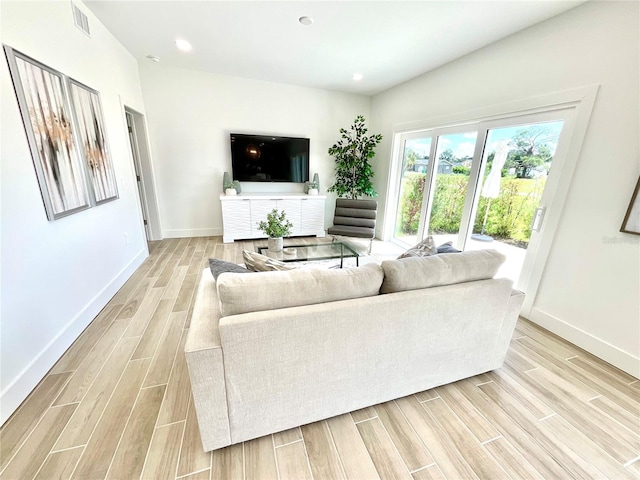 living room with light hardwood / wood-style floors