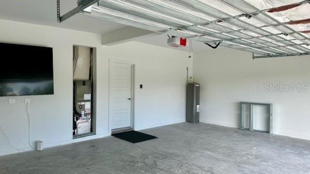 garage featuring a garage door opener and water heater