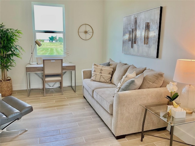 living room with light hardwood / wood-style flooring