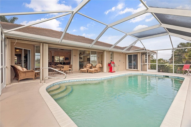 view of pool featuring a patio area and a lanai