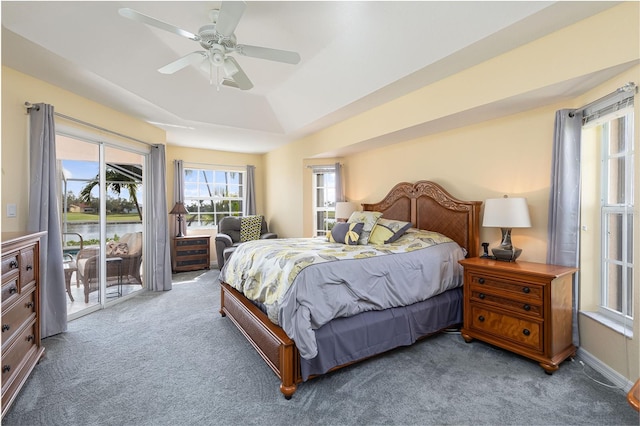 carpeted bedroom featuring access to outside and ceiling fan