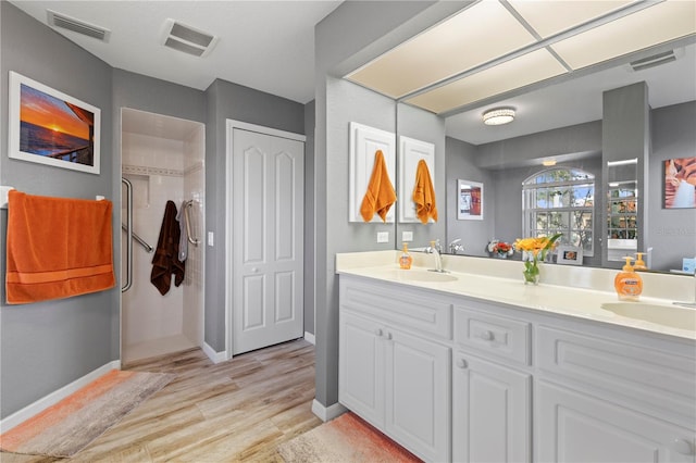 bathroom featuring vanity and hardwood / wood-style flooring