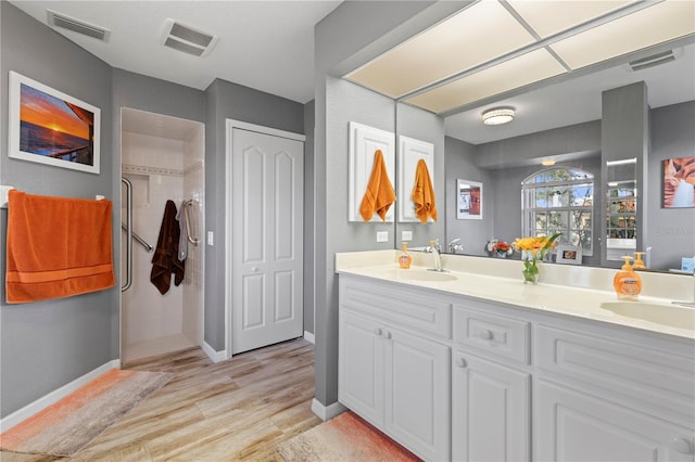 4077 La Costa Island Ct, Punta Gorda, FL 33950 - full bath featuring a sink, wood finished floors, and visible vents