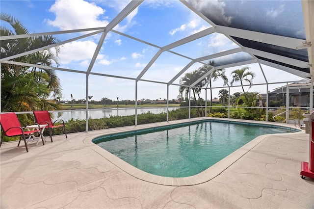 view of swimming pool featuring a water view, a patio area, and glass enclosure