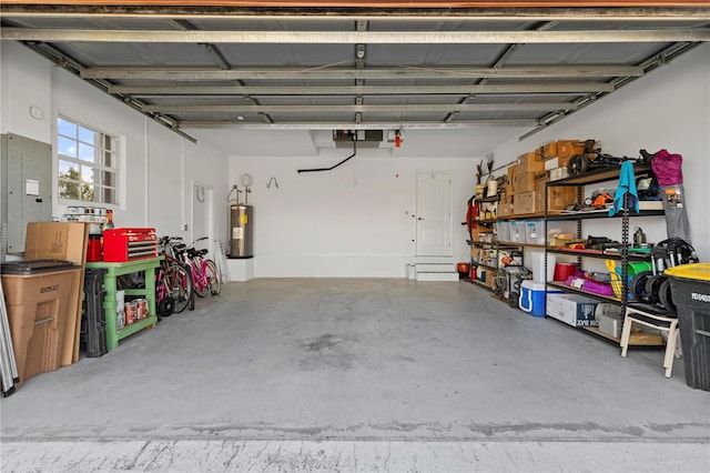 garage featuring water heater and electric panel