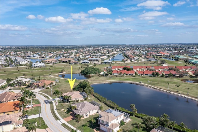 birds eye view of property with a water view