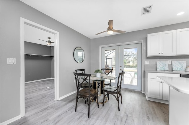 dining room featuring light hardwood / wood-style floors, french doors, and ceiling fan