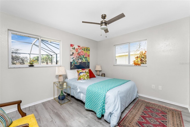 bedroom featuring ceiling fan and light hardwood / wood-style flooring