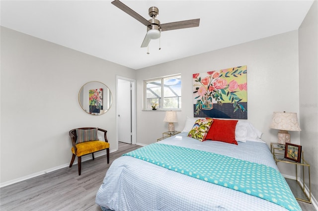 bedroom with wood-type flooring and ceiling fan