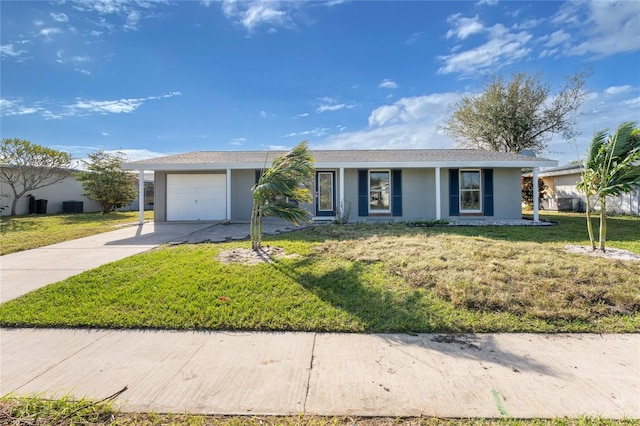 ranch-style house featuring a front yard and a garage