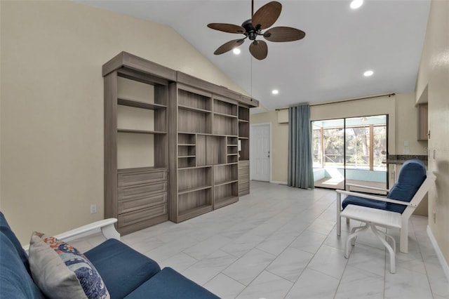 living room featuring ceiling fan and lofted ceiling