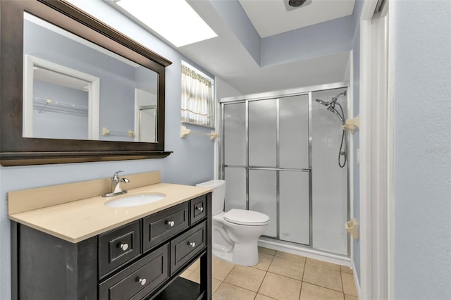 bathroom featuring vanity, tile patterned floors, toilet, and an enclosed shower