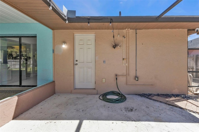 doorway to property featuring a patio area