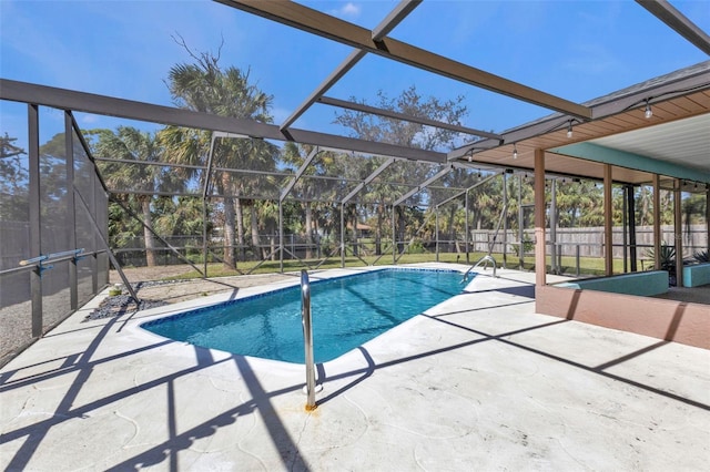 view of pool with a patio and a lanai