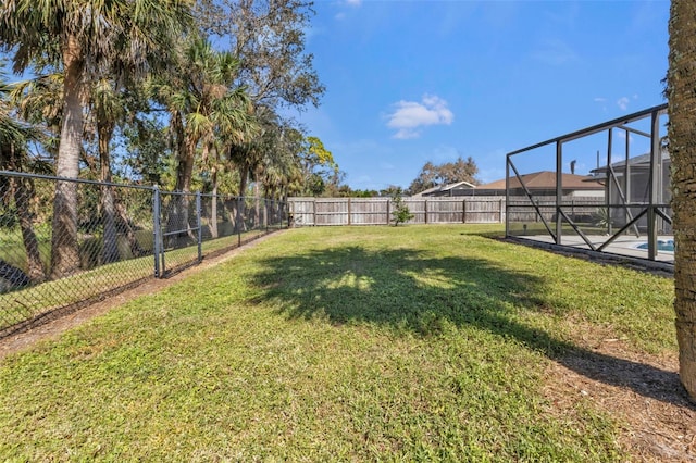 view of yard with a lanai