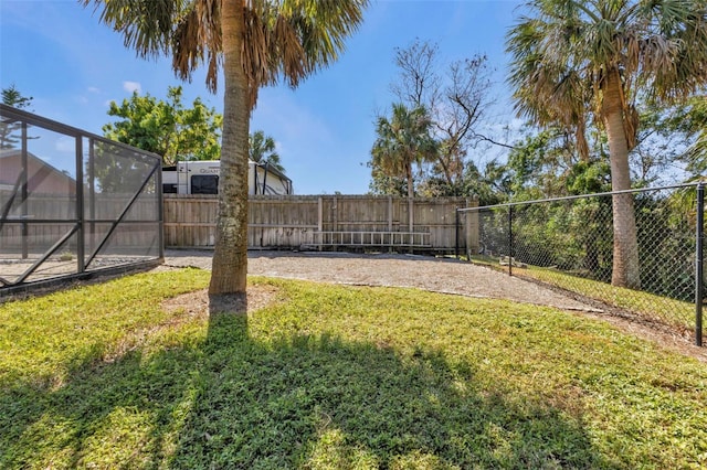 view of yard featuring glass enclosure