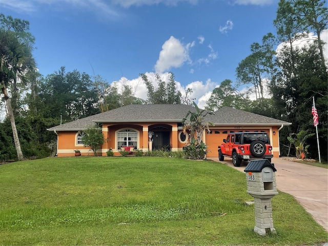 ranch-style home with a front lawn and a garage