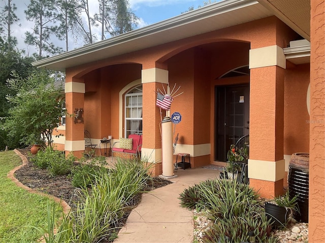 doorway to property with a patio area