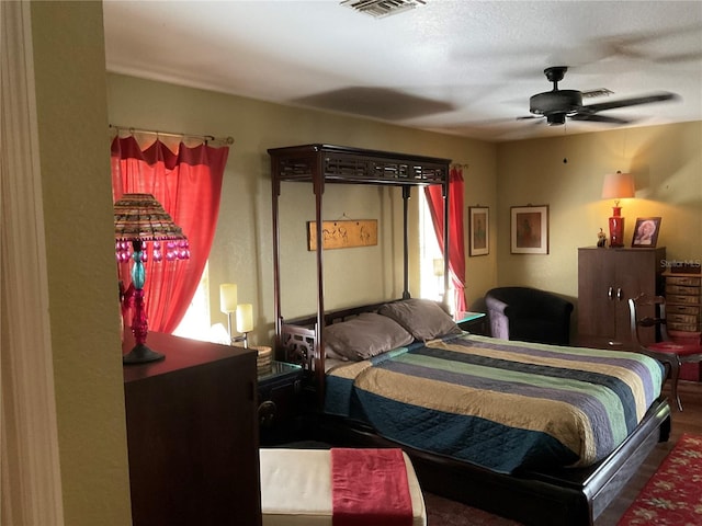 bedroom with a textured ceiling and ceiling fan