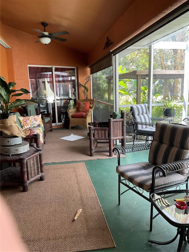 sunroom / solarium with vaulted ceiling and ceiling fan