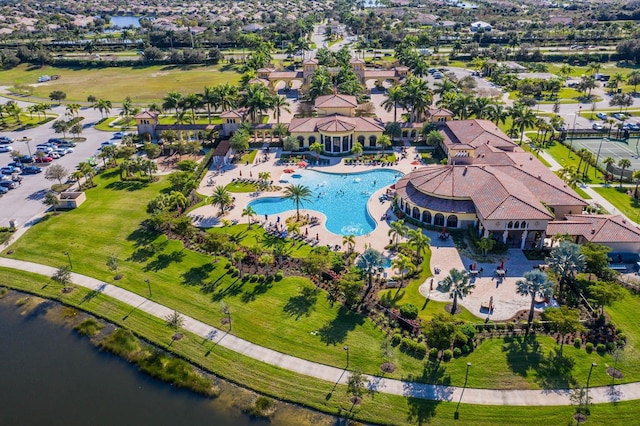 birds eye view of property with a water view