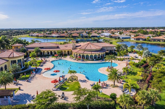 view of pool featuring a water view