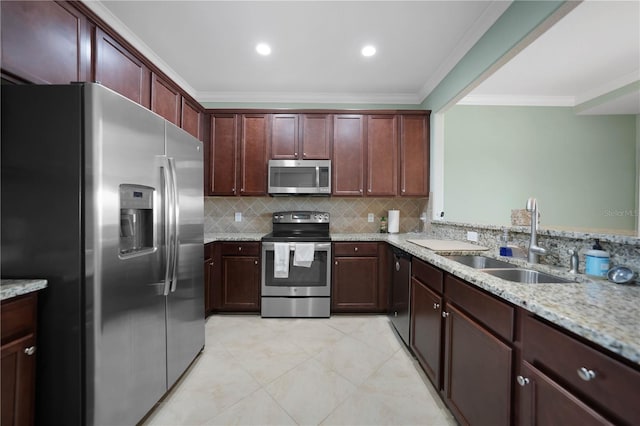 kitchen with sink, light stone counters, crown molding, decorative backsplash, and appliances with stainless steel finishes