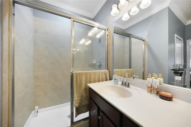 bathroom featuring vanity, ornamental molding, and a shower with door