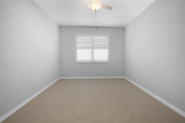 carpeted empty room with ceiling fan