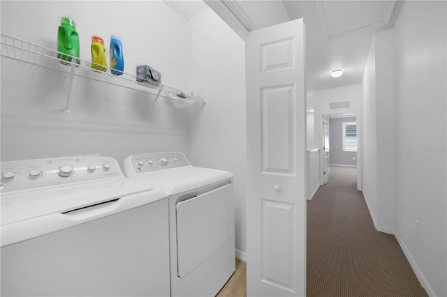 washroom with light carpet and separate washer and dryer