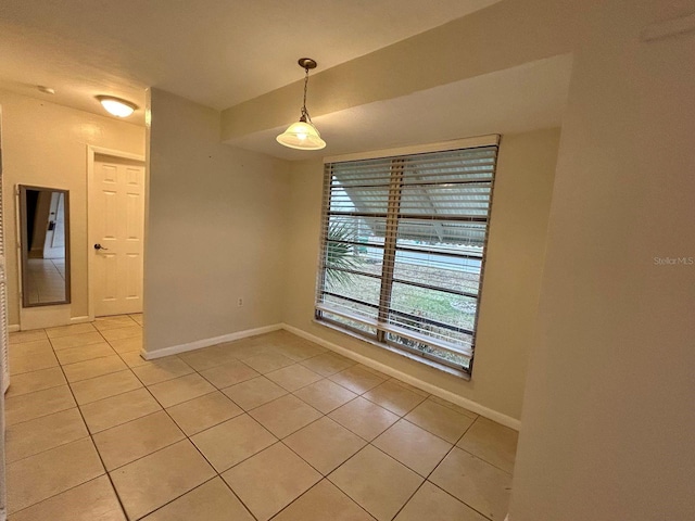 unfurnished dining area with light tile patterned flooring