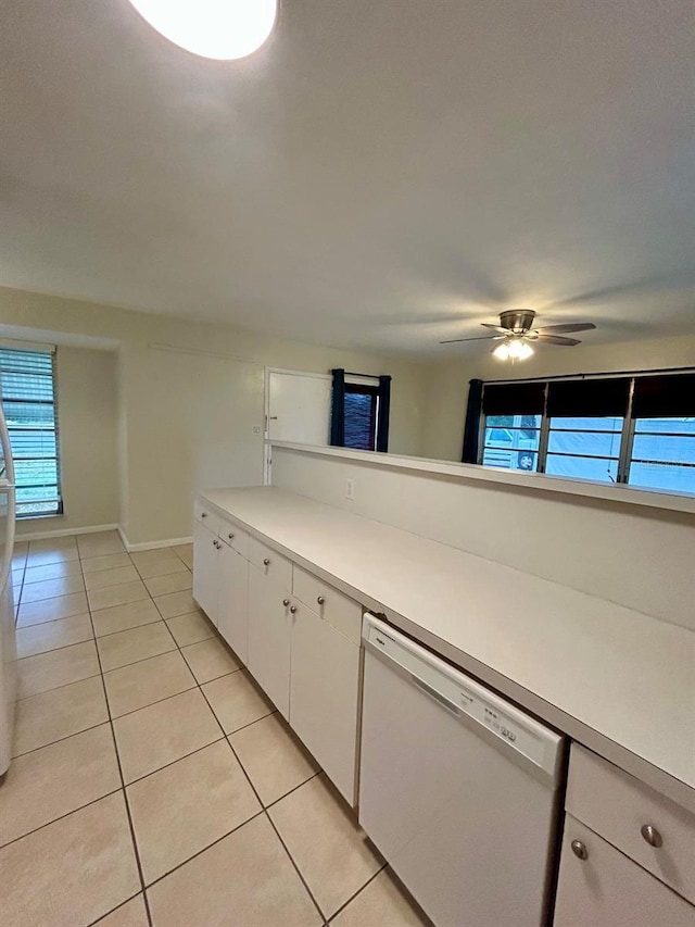 kitchen with white cabinets, dishwasher, ceiling fan, and light tile patterned floors