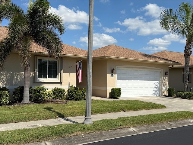 ranch-style house with a front yard and a garage