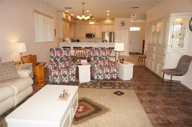 living room with ceiling fan with notable chandelier