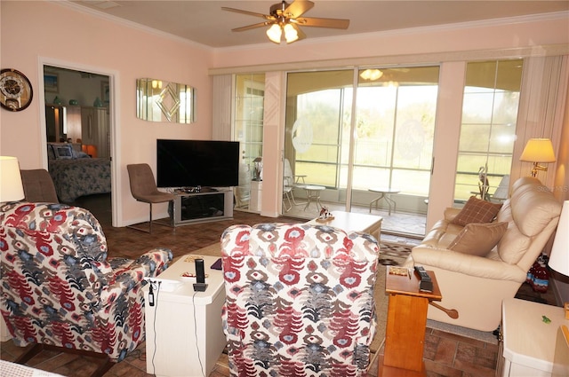 living room featuring ornamental molding and ceiling fan