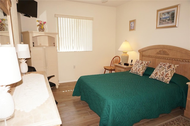 bedroom featuring wood-type flooring