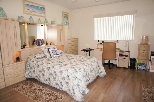 bedroom featuring wood-type flooring