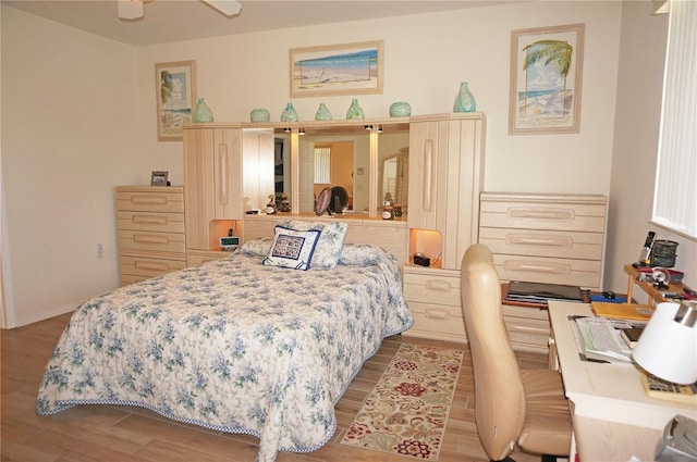 bedroom featuring light hardwood / wood-style floors and ceiling fan