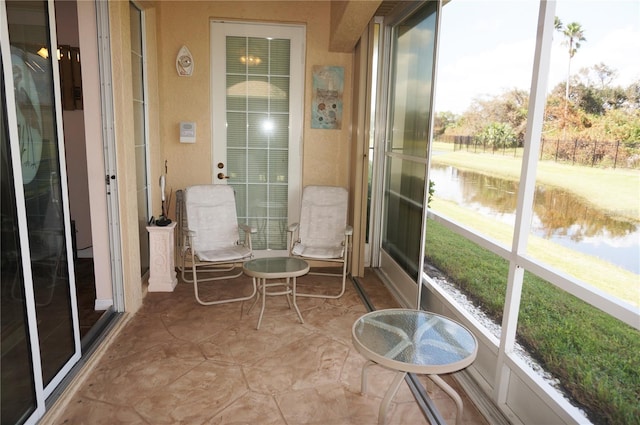 sunroom with a water view