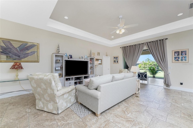 living room with ceiling fan, crown molding, and a raised ceiling