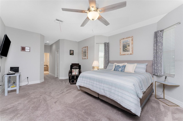 bedroom with ceiling fan and light carpet