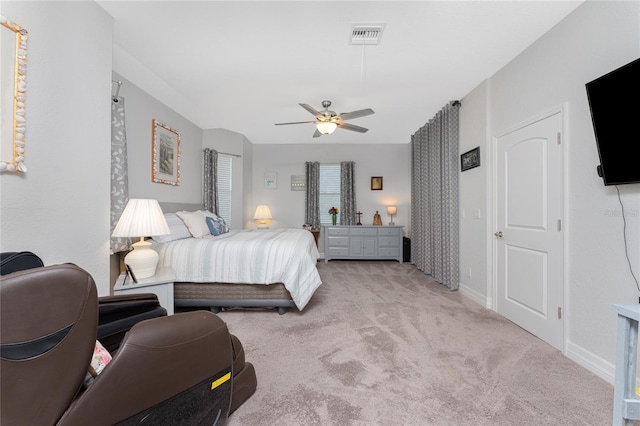 bedroom with light carpet and ceiling fan