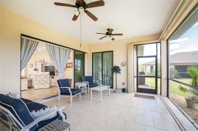 sunroom / solarium with ceiling fan