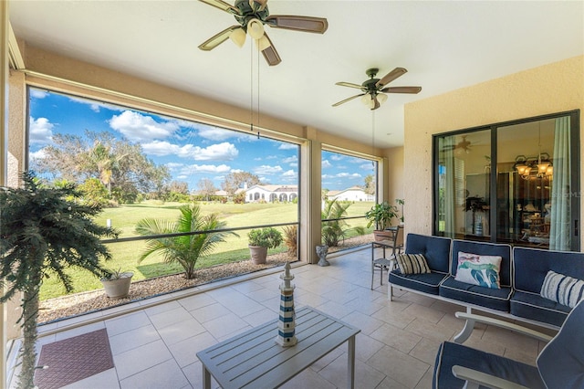 sunroom with ceiling fan