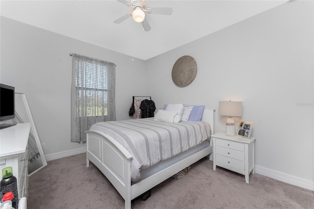 bedroom featuring light colored carpet and ceiling fan