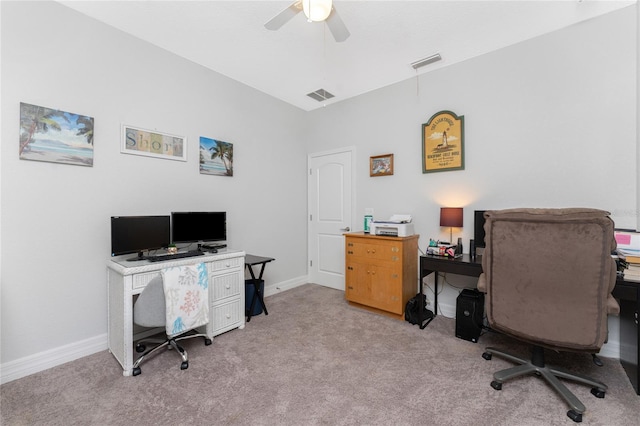 carpeted office space with ceiling fan