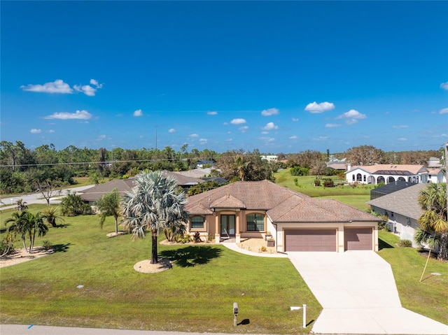 mediterranean / spanish-style house featuring a front lawn and a garage