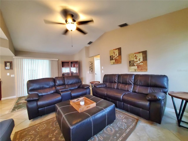 living room with vaulted ceiling, light tile patterned floors, and ceiling fan